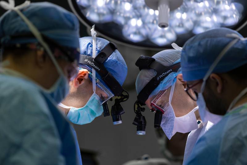 Cardiac surgeons working in an operating room