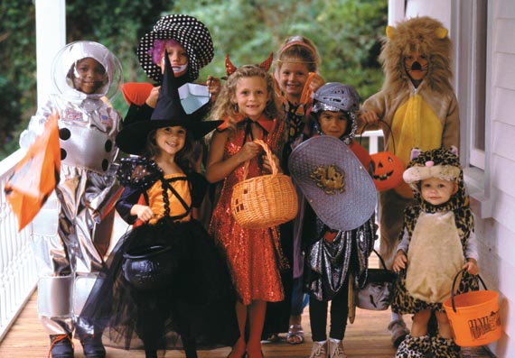 Group of children dressed up in Halloween costumes