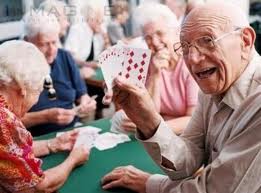 Group of senior citizens enjoying a card game