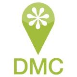Destination Medical Center (DMC) green and white exclamation logo