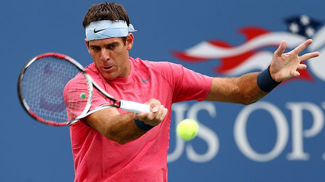 Blue U.S. Open background with tennis player Del Porto in white sweatband and pink shirt hitting tennis ball.