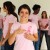 woman wearing breast cancer awareness shirt