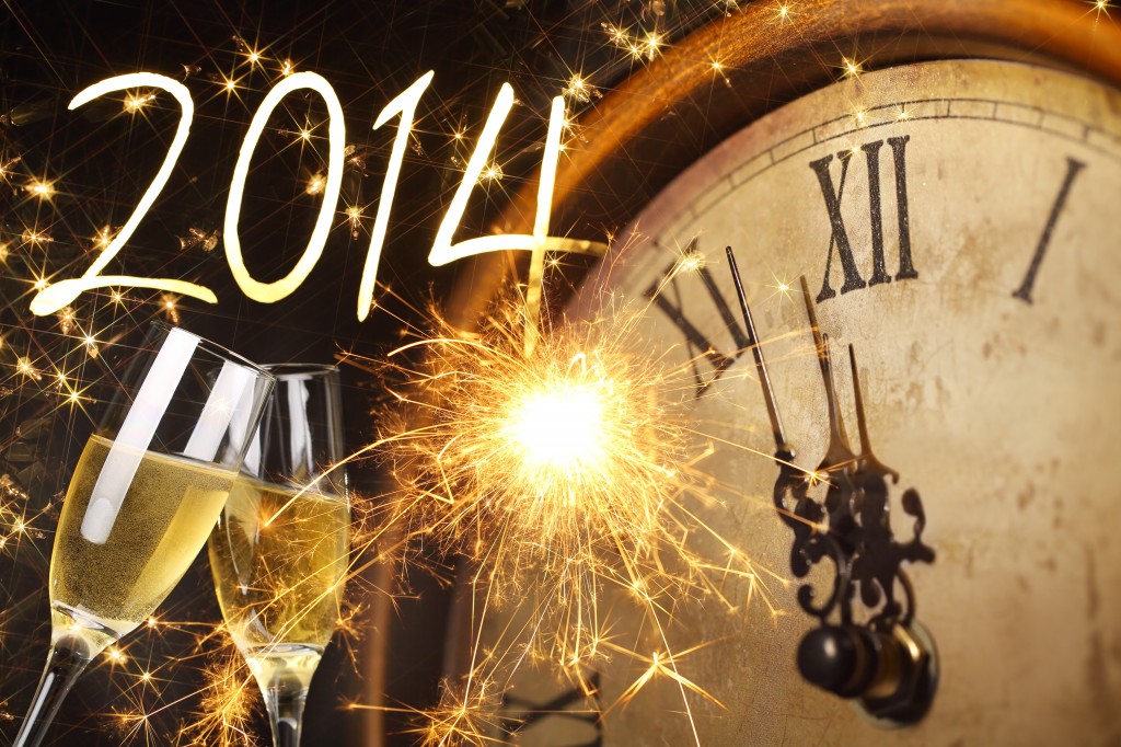 2014 New Year's clock with sparklers and glasses of champagne