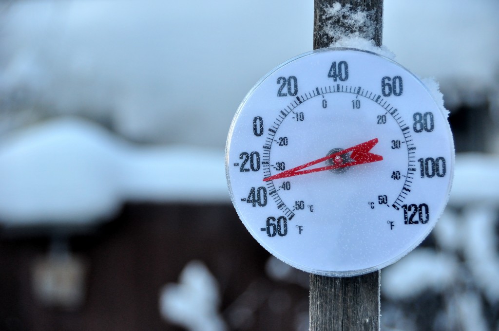 Outdoor winter thermometer showing -30 degrees