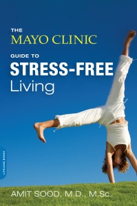 Book cover Mayo Clinic's Guide to Stress-Free Living, with female doing cartwheel