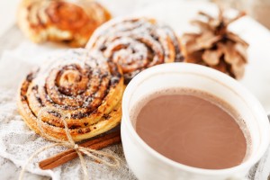 Warm winter food with sweet rolls and hot cocoa