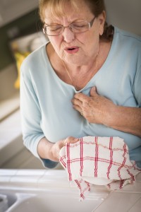 Woman having chest pain heart attack