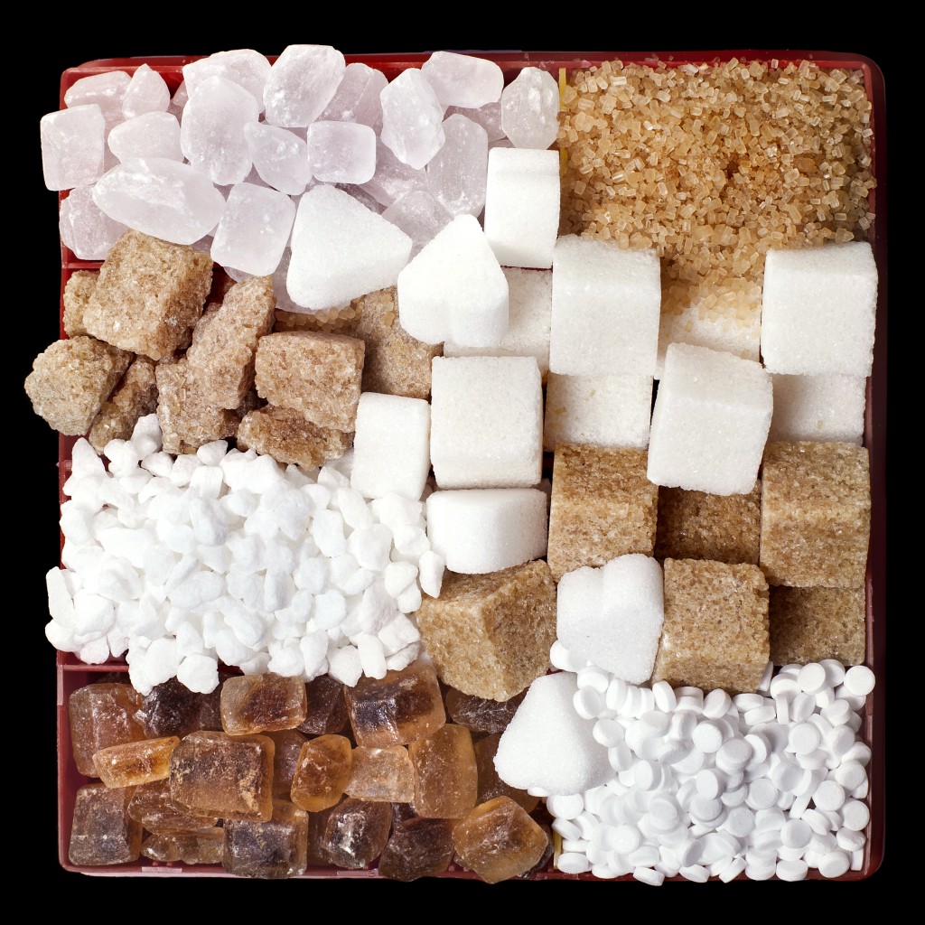 Closeup of sugar cubes and crystals with sweeteners