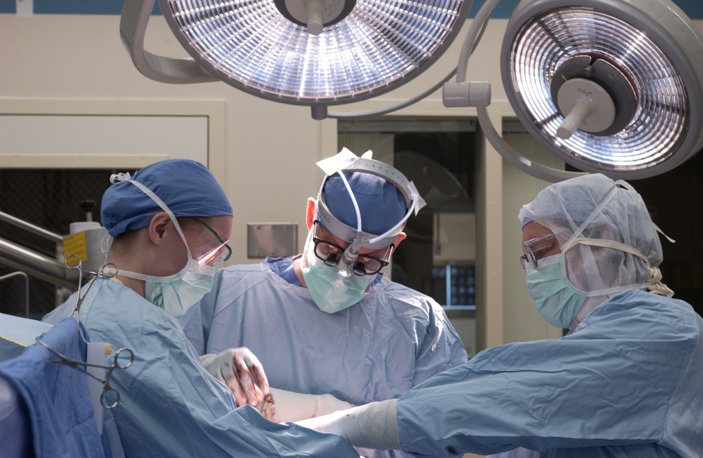 Medical staff in operating room performing surgery