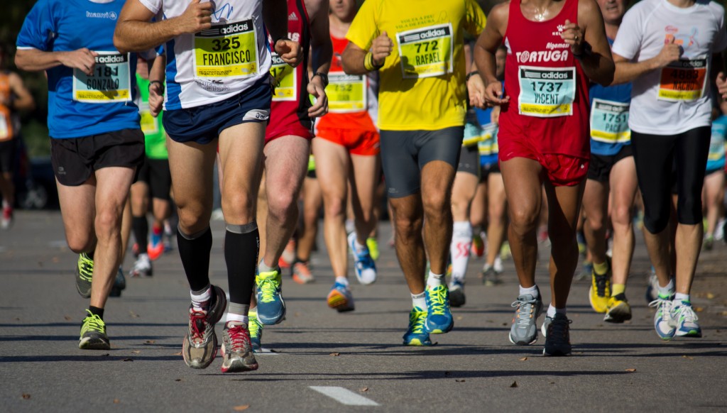 Group picture of runners legs in a race