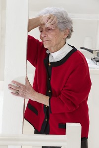 Senior woman appearing to have head pain or stroke