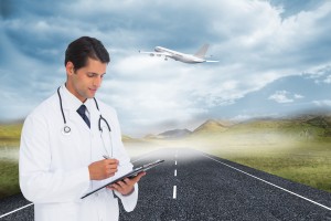Doctor writing on clipboard with airplane taking off in background