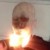 mannequin with bottom portion of the face in flames