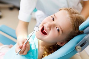 Little girl in chair for dental exam
