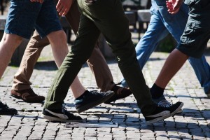 several men walking on brick road