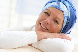 woman with headscarf after chemotherapy and cancer treatment