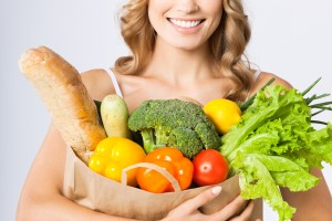woman holding bag of vegetables for vegetarian diet