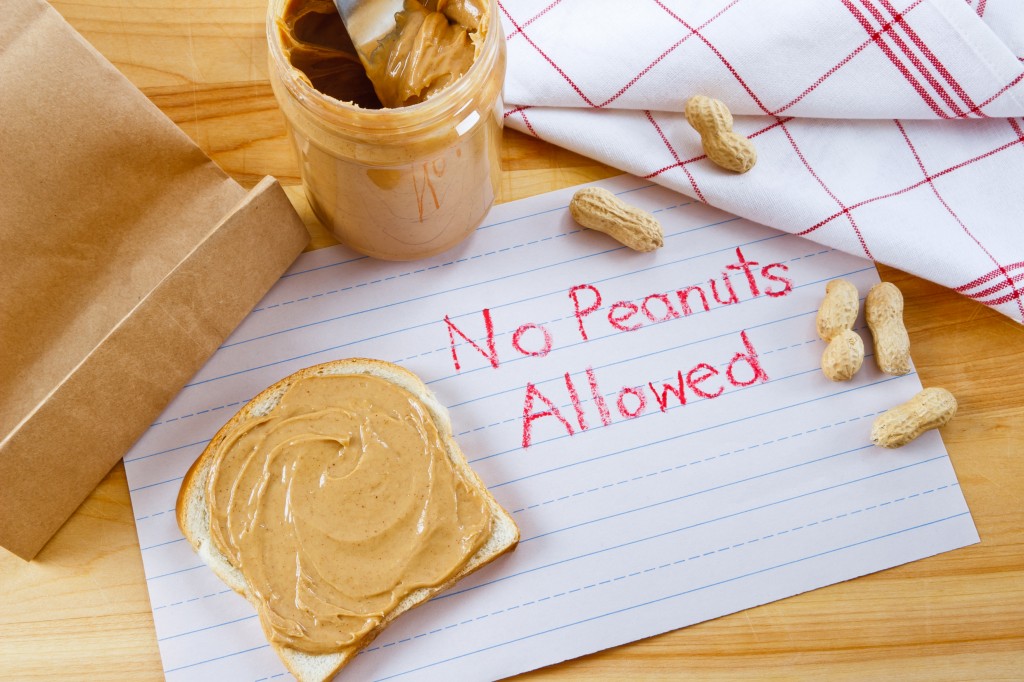 food allergies sign that says 'no peanuts' next to peanut butter jar
