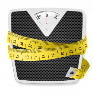 weight scale wrapped with a yellow measuring tape