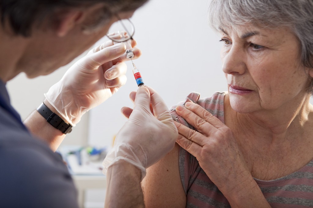 vaccinating an elderly woman - senior citizen