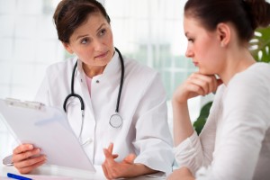 woman talking to female physician about health