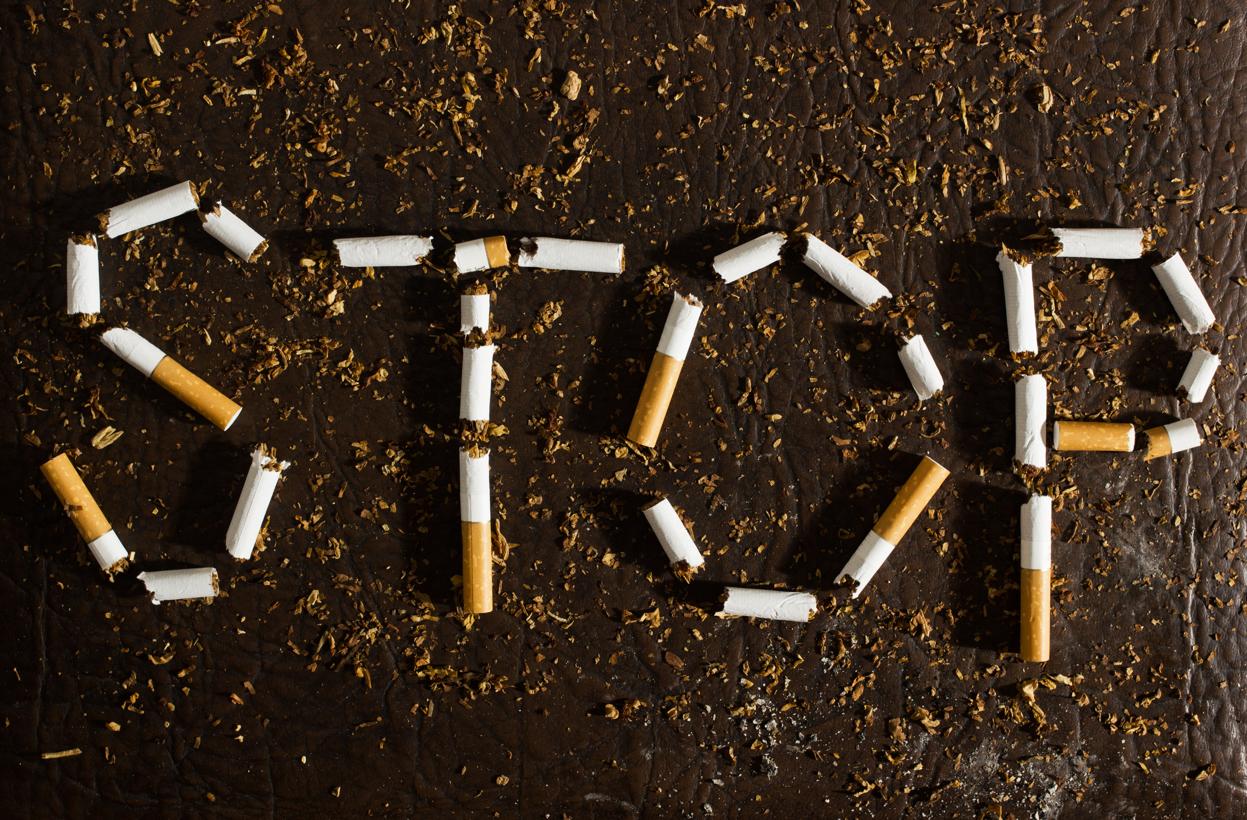 the word 'stop' spelled out with tobacco cigarettes