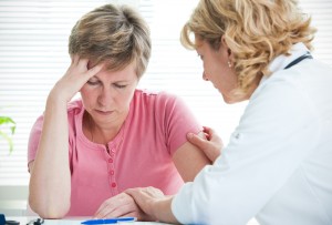 Adult woman talking to doctor about her diagnosis