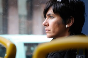 woman staring out a window deep in thought
