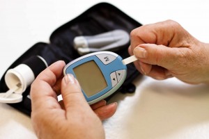 person checking diabetes strip