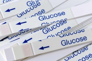 the word glucose on diabetes testing strips