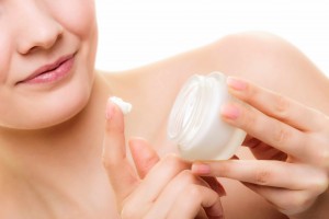 woman with skin creme for dry skin
