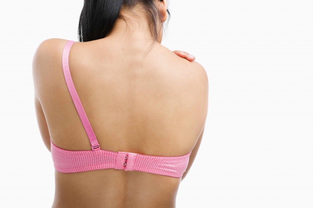 back of woman with bra strap missing representing breast cancer surgery