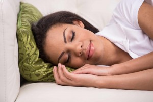 African-American woman sleeping, napping resting on pillow