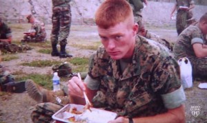 marine Josh Russell in uniform, eating breakfast