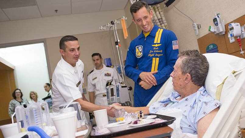 Blue Angels pilots visits patient in hospital bed