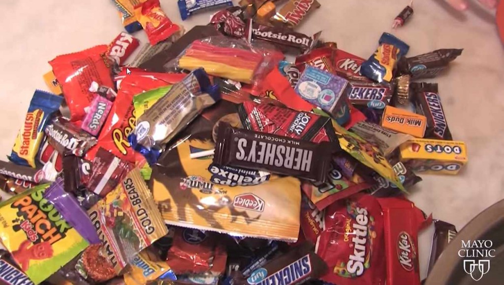 pile of candy and treats from Halloween