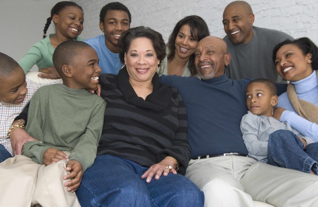 multi generational African American family sitting on a couch