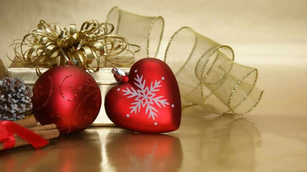 holiday ornaments, one shaped like a heart