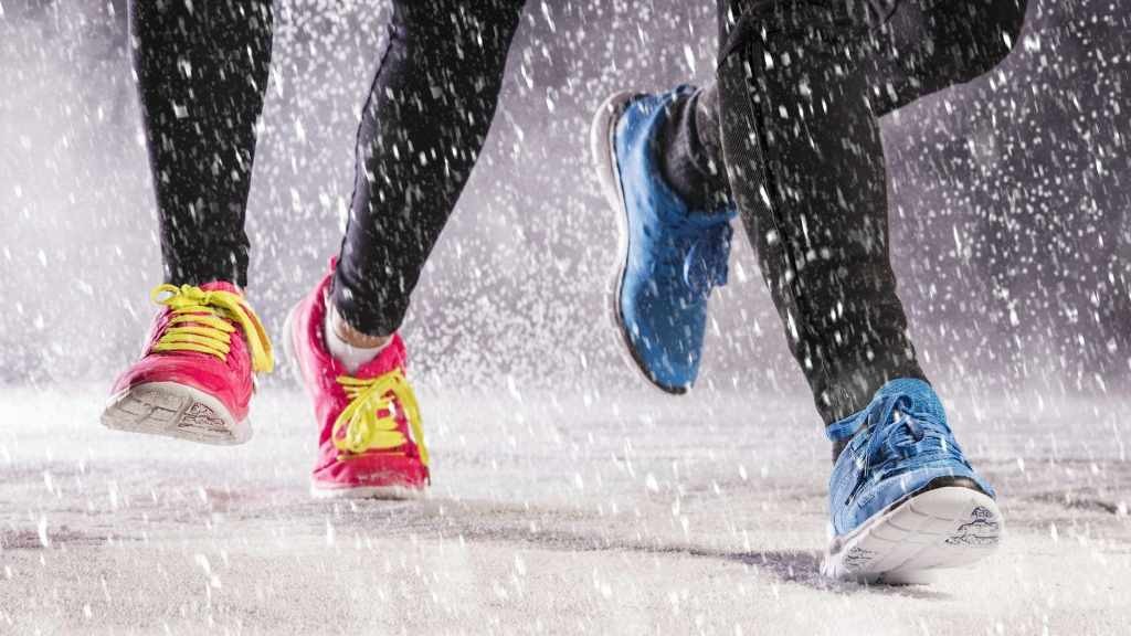 people running, jogging in winter snow and on icy path