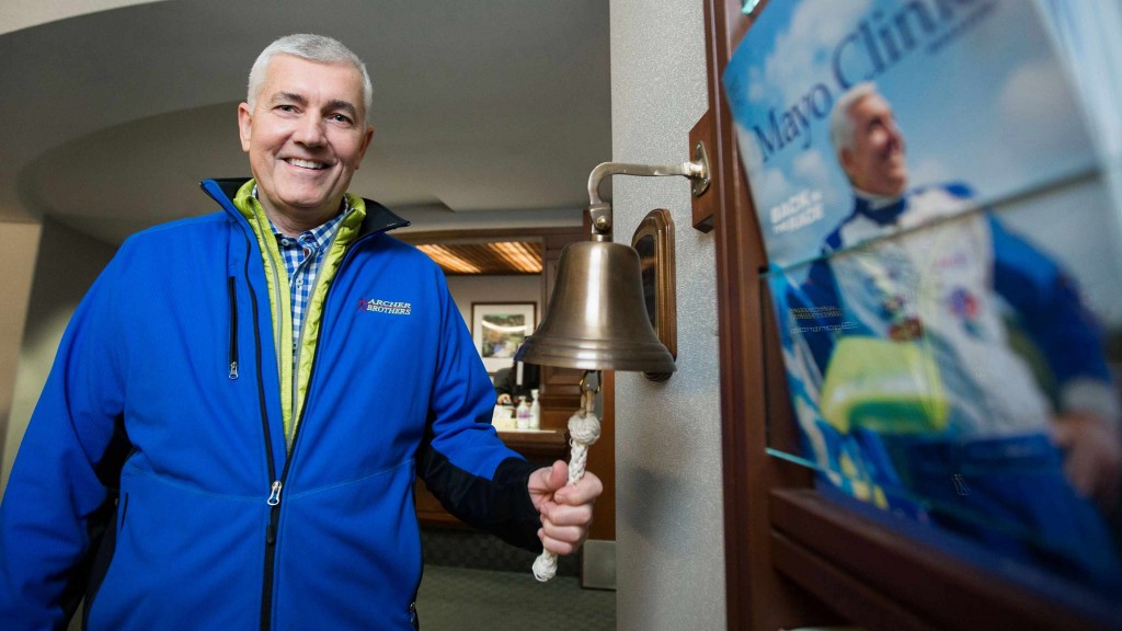 Tommy Archer ringing the bell to mark the end of radiation treatments