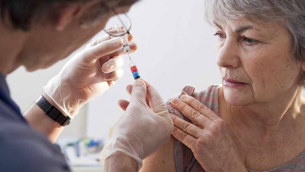 older woman receiving a vaccination
