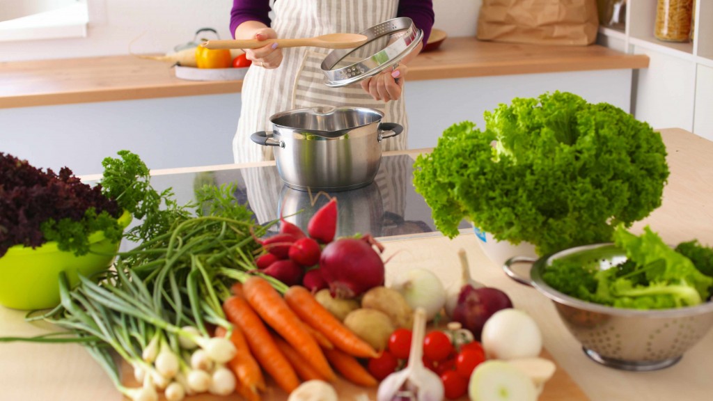 a chef in the kitchen with pots, pans and healthy vegetables