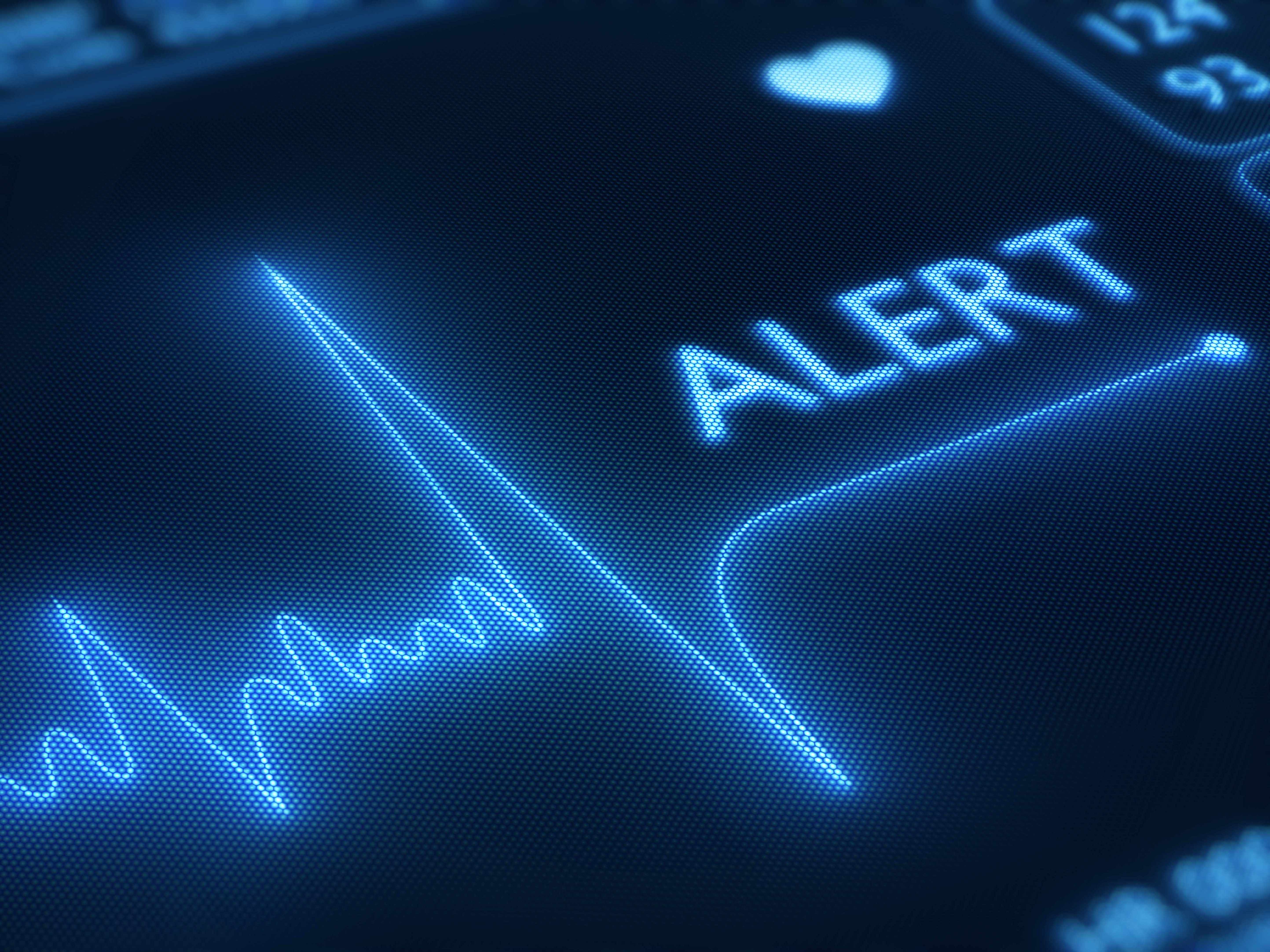 closeup of heart monitor with the text word alert