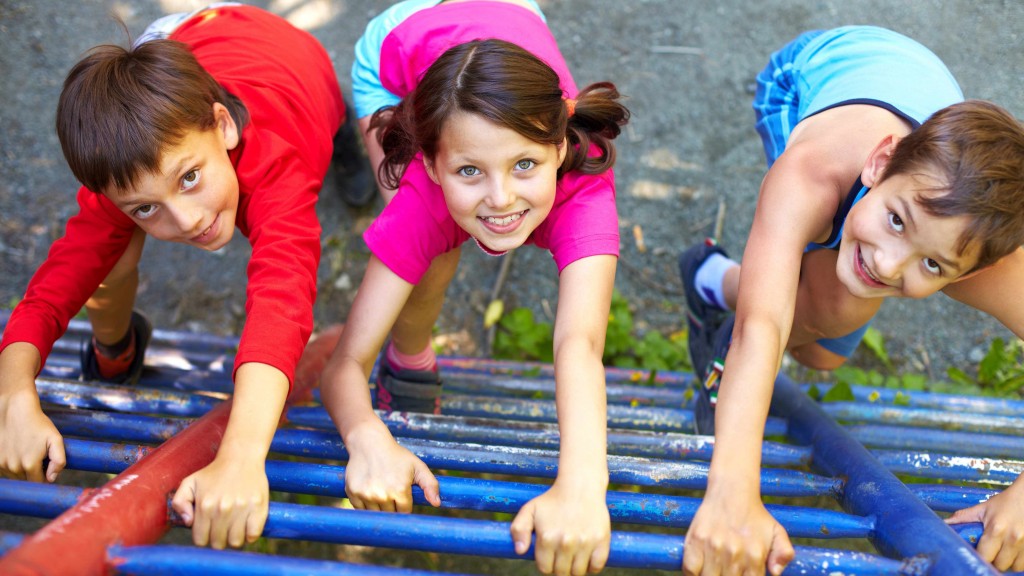children smiling, climbing on the playground