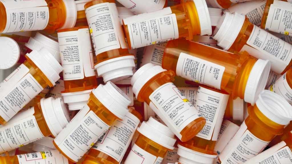 pile of prescription drug bottles 16x9