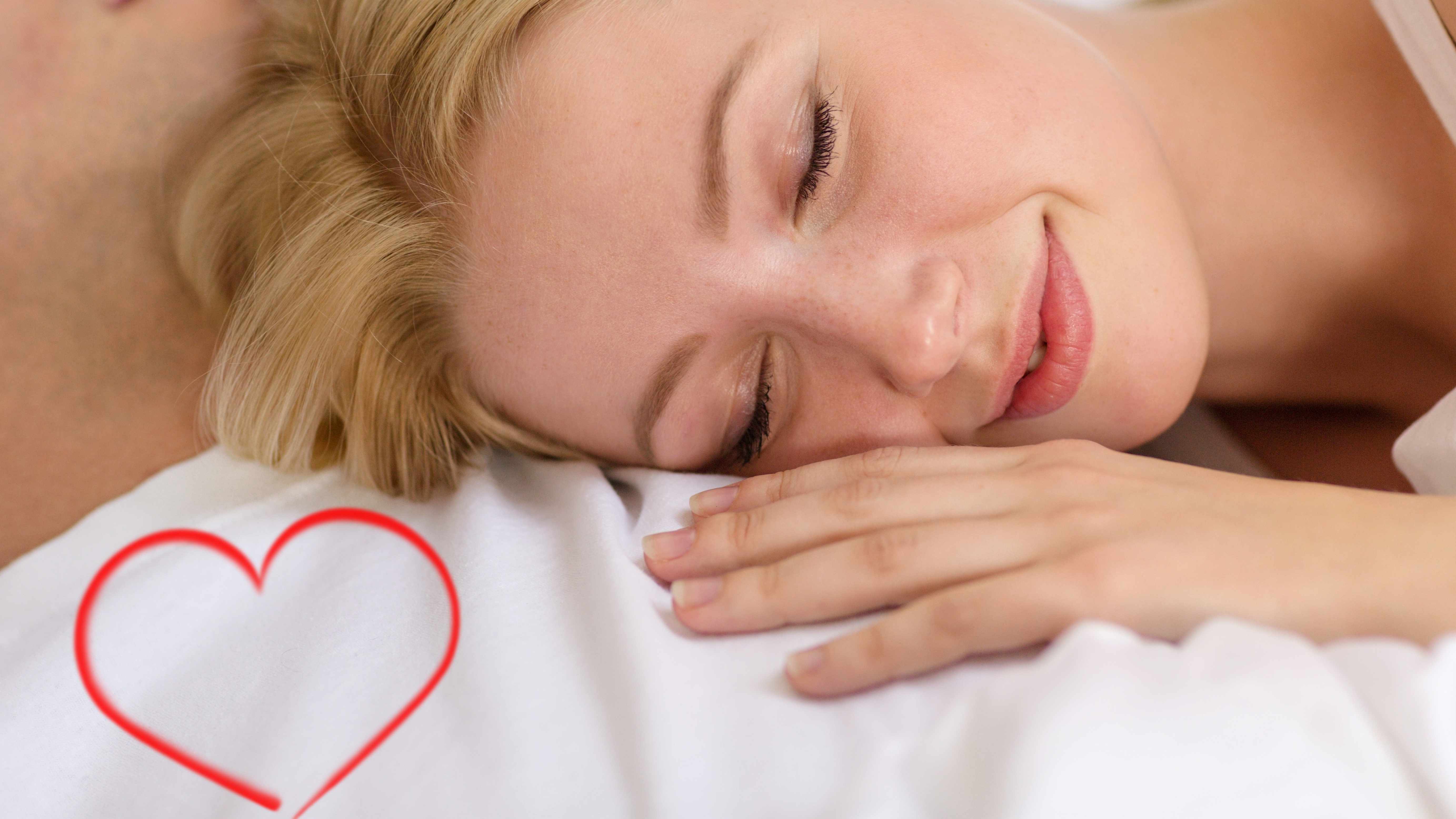 woman sleeping peacefully, loving sleep with a heart drawn in the corner