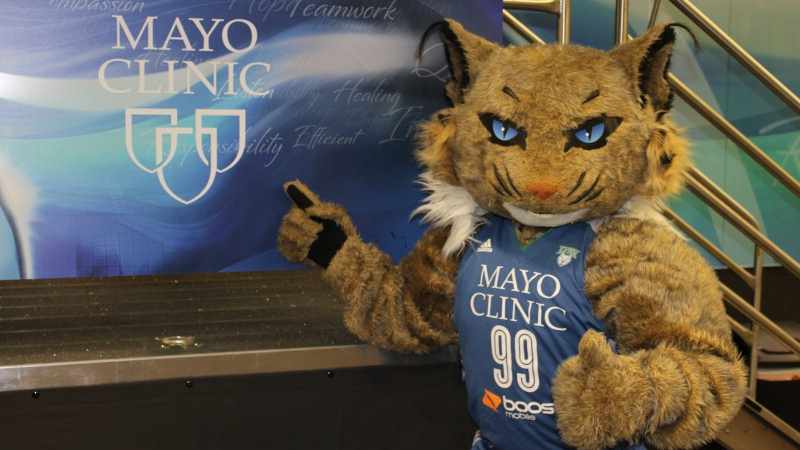 Minnesota Lynx mascot in front of Mayo Clinic sign