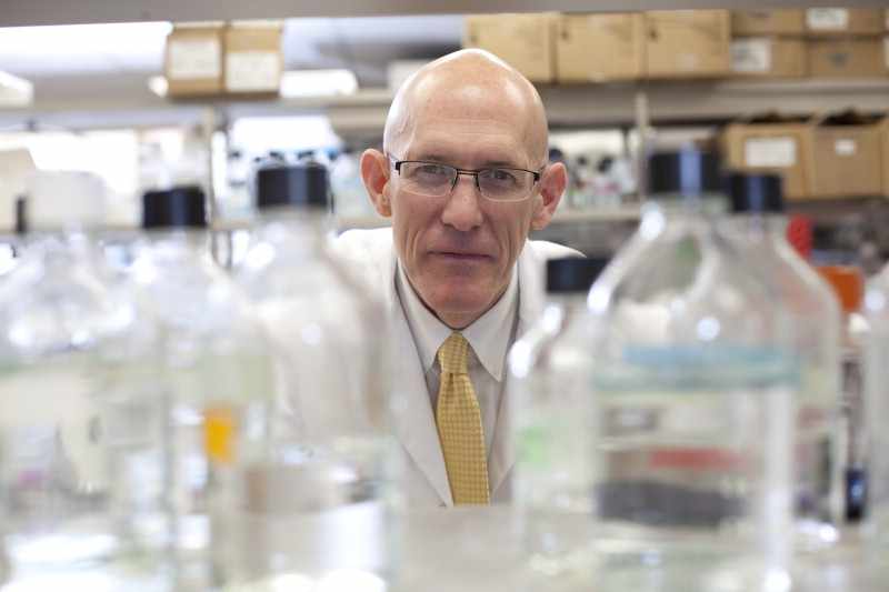Dr. Greg Poland working in vaccine research lab