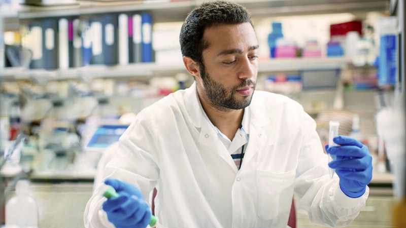 a male researcher working in a laboratory