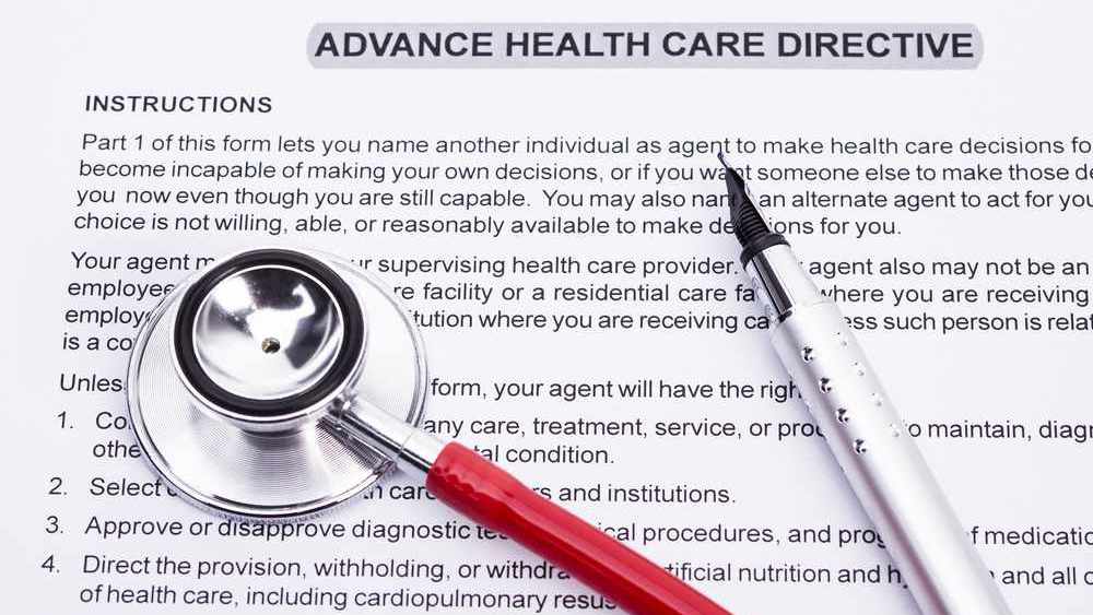 advance directive paperwork, with a stethoscope and fountain pen